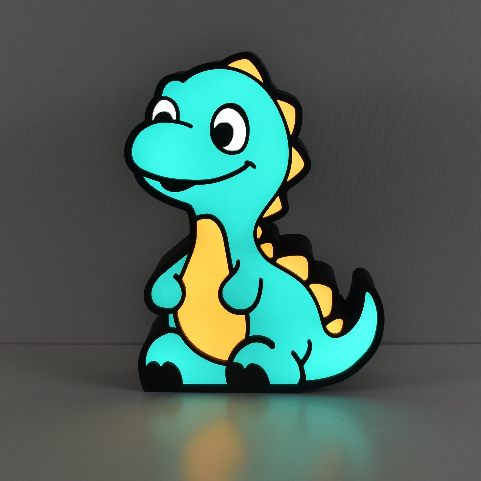 Leuchtende Dino Nachtlicht Lampe in Grün und Orange für Kinderzimmer  